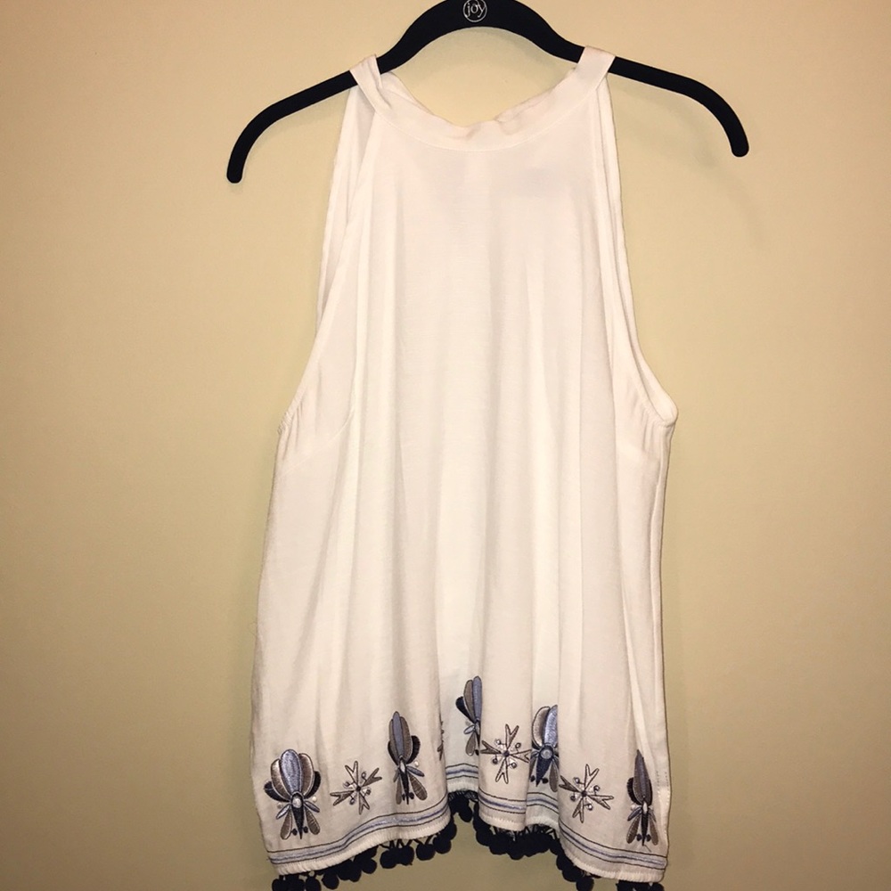 Francesca’s white top with tassels on bottom!